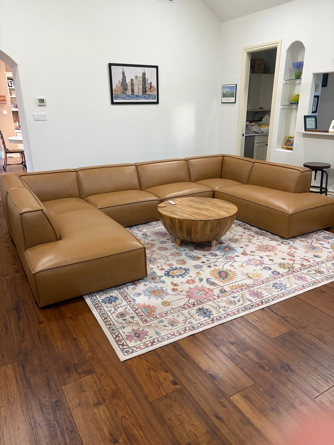 Caramel leather modular sofa in customer living room